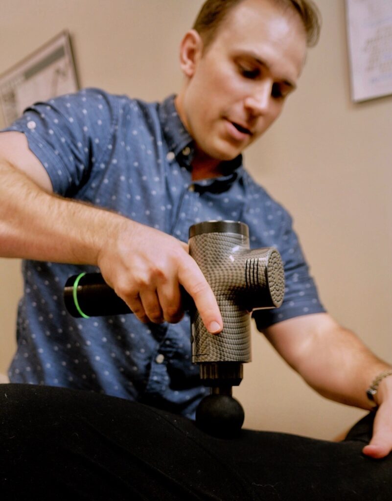 New Orleans chiropractor performing spinal alignment on a patient. Holistic healthcare and pain management