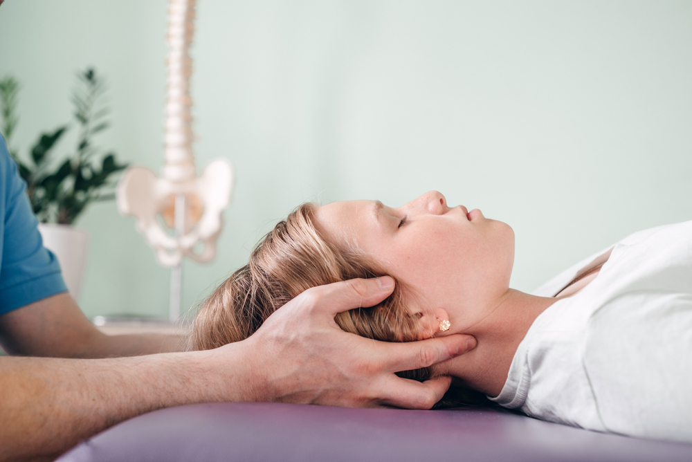 A young girl undergoing CST, featuring chiropractic care for children in New orleans with a new orleans chiropractor.